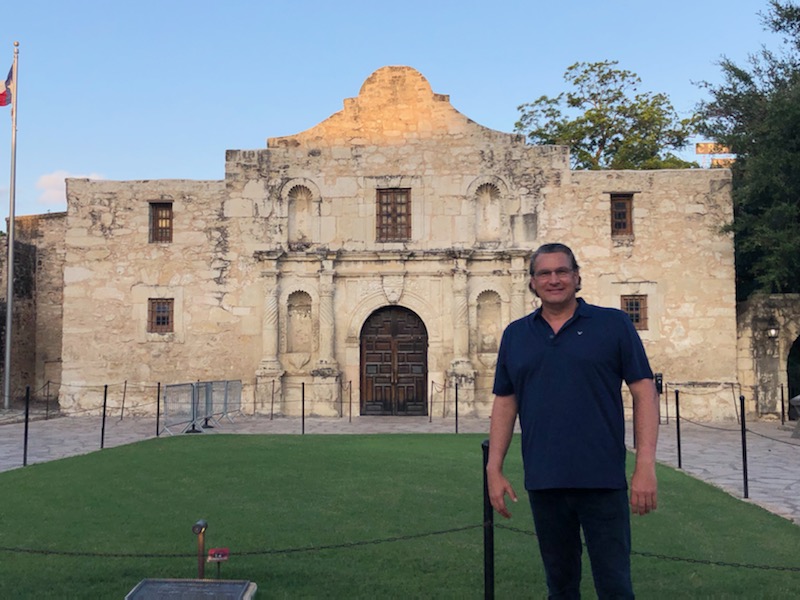 Michael stands in front of the Alamo